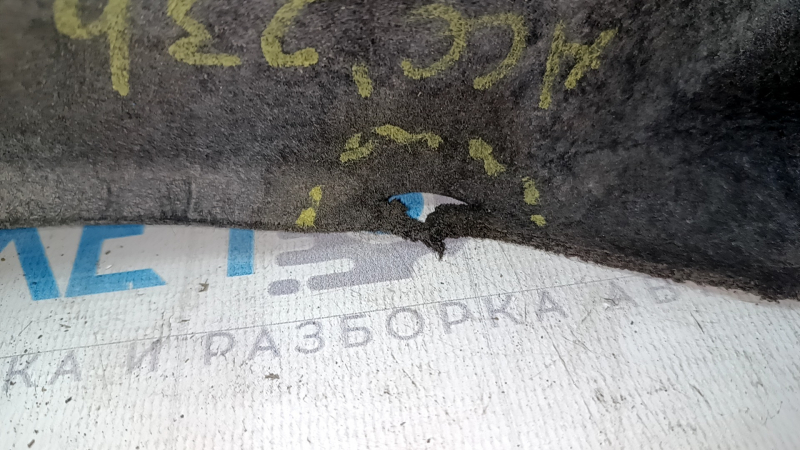 The rear right fender liner of a Honda Accord 23-24 is torn.