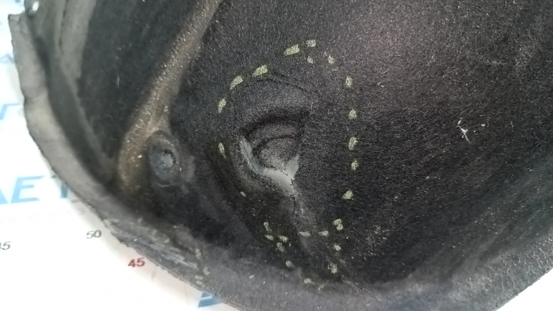 The front left fender liner of a Chevrolet Equinox 18-24 is torn.