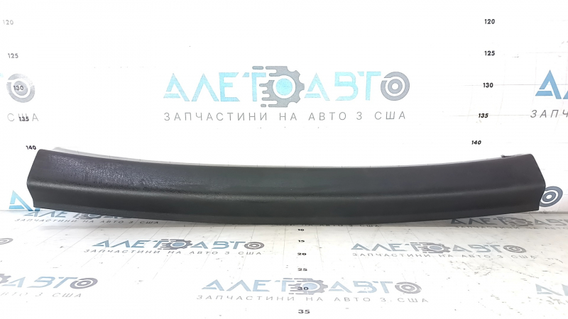 Upper trunk door trim for a Nissan Pathfinder 13-20, black, scratched, worn