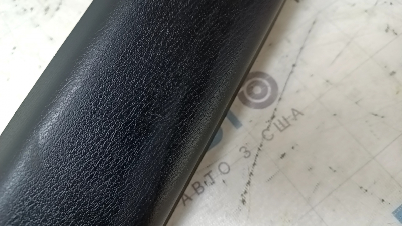 Upper trunk door trim for a Nissan Pathfinder 13-20, black, scratched, worn