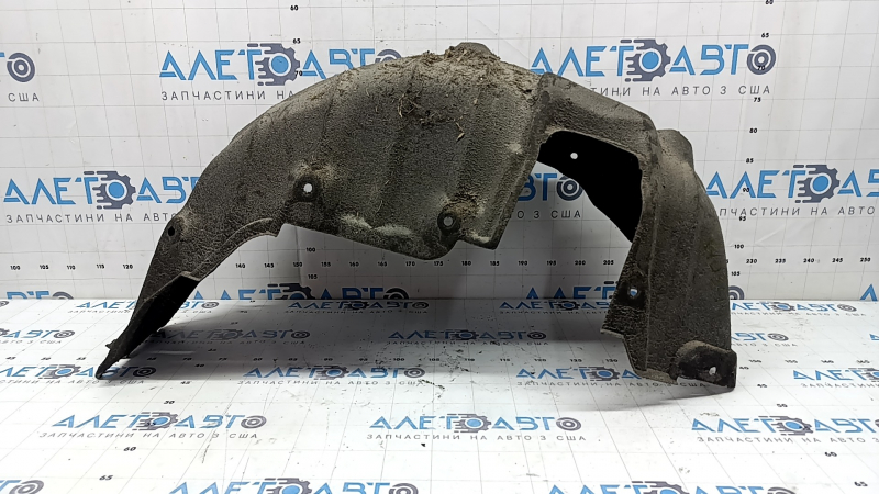 The rear right fender liner of a Lexus CT200h 11-17 has torn fasteners.