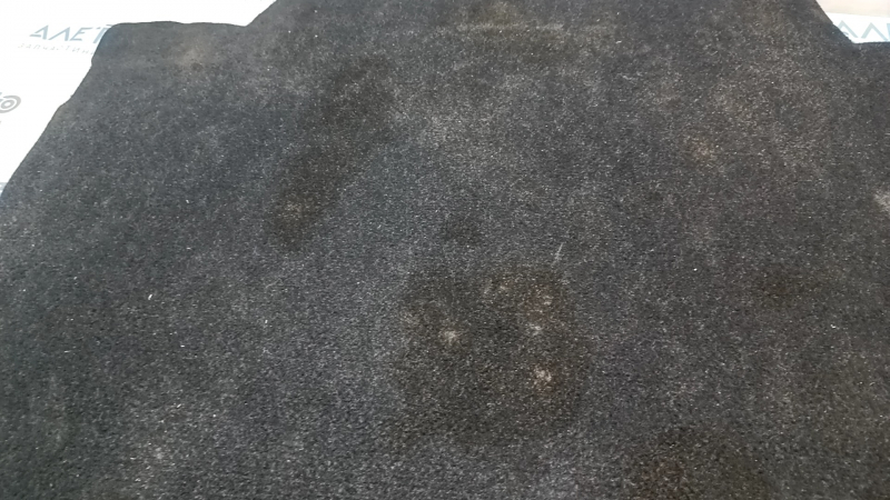The trunk floor of a 16-23 Chevrolet Malibu needs to be dry cleaned, peeled off.