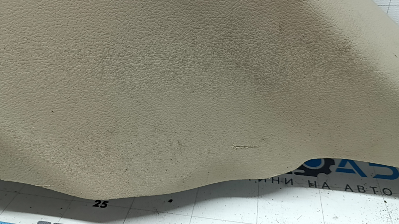 Left arch trim for a Jeep Grand Cherokee WK2 18-20, beige, electric, with hooks, scratches, crack, needs cleaning