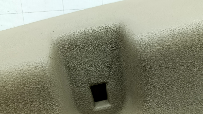 Left arch trim for a Jeep Grand Cherokee WK2 18-20, beige, electric, with hooks, scratches, crack, needs cleaning