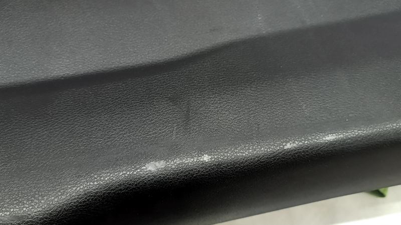Jeep Renegade 15-23 black tailgate trim with scratches, cracks in fasteners, and abrasions