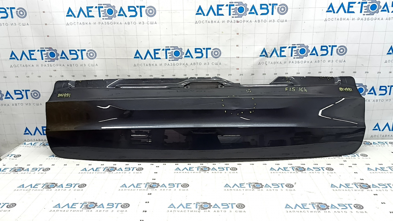 The trunk door is bare, the lower part of the BMW X5 F15 14-18 graphite A90, there are nicks, scratches, and a dent.
