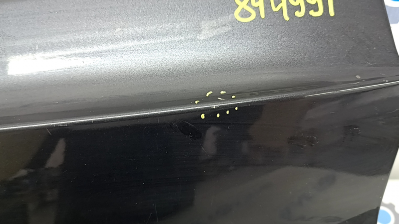 The trunk door is bare, the lower part of the BMW X5 F15 14-18 graphite A90, there are nicks, scratches, and a dent.