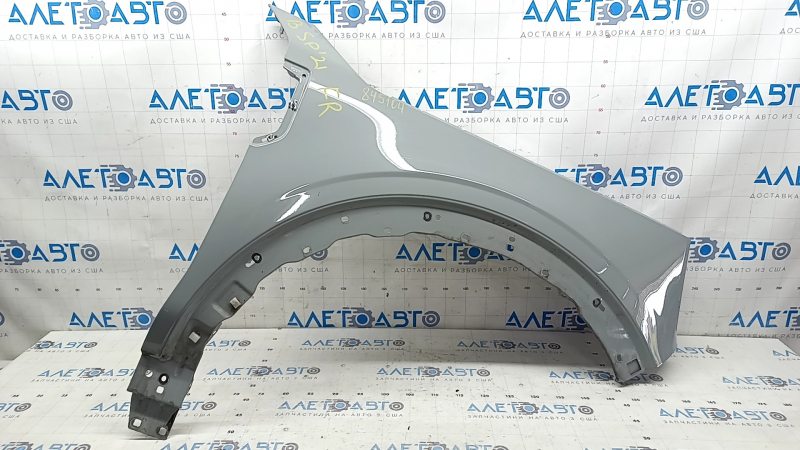 Front right fender of a 2015 Ford Bronco Sport, gray NE, chip, scratch