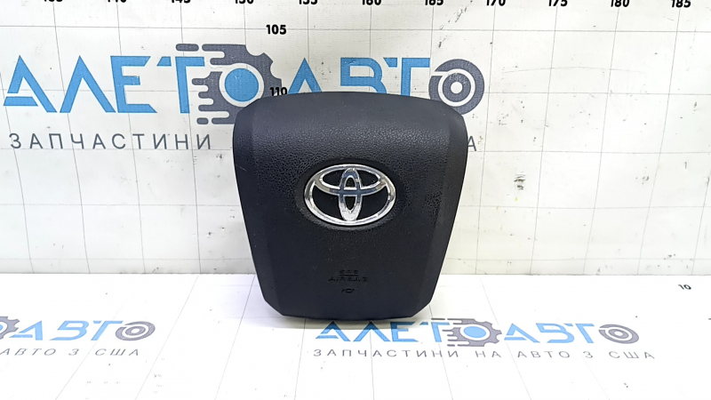 The driver's steering wheel airbag for a Toyota Prius 50 16-22 is black and has a rusty squib.