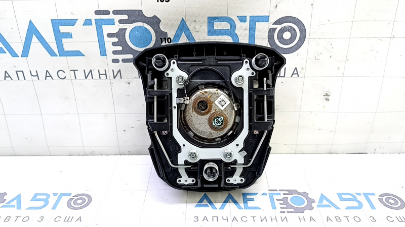 The driver's steering wheel airbag for a Toyota Prius 50 16-22 is black and has a rusty squib.