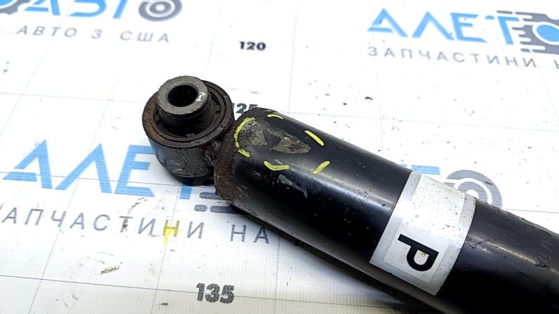 The rear right shock absorber of the Nissan Rogue Sport 17-22 is dented.