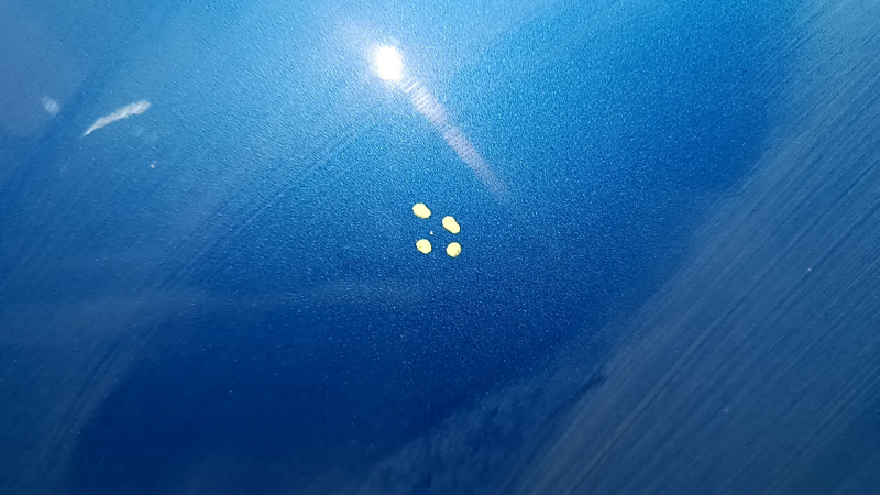 The bare hood of a Hyundai Tucson 16-21 blue R2U, steel, paint chips, bump