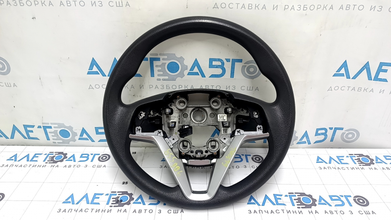 The steering wheel is bare, Hyundai Tucson 19-21, black rubber, cracked.