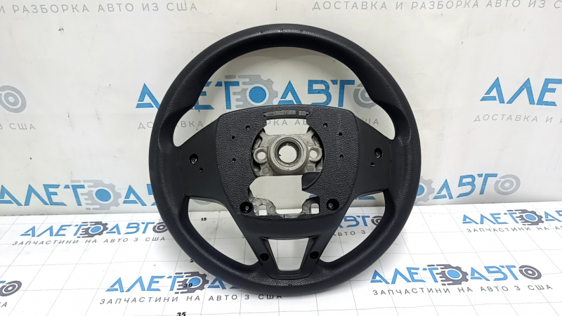 The steering wheel is bare, Hyundai Tucson 19-21, black rubber, cracked.