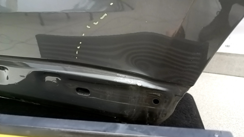 Bare rear left door of Audi Q3 83A 19-25 silver LX7G, dented