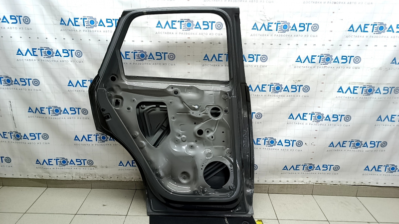 Bare rear left door of Audi Q3 83A 19-25 silver LX7G, dented