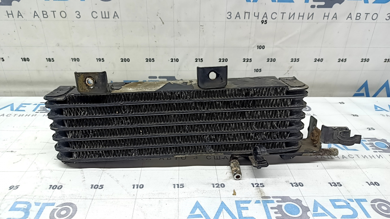Lexus RX400h 06-09 transmission cooling radiator with dented cells and rusty parts