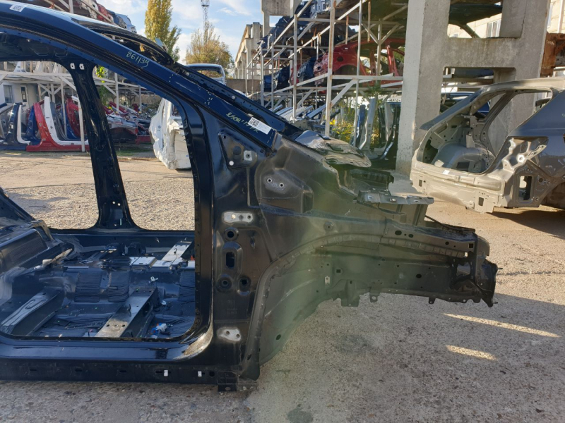 Front right quarter panel of a Ford Escape MK3 2017-2019, black on the body, dents