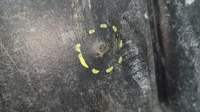 The front bumper guard of the Toyota Highlander 20-22 is worn and torn.