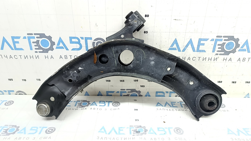 The front right lower control arm of a Mazda 3 19-23 Mexico-built model has a torn boot.