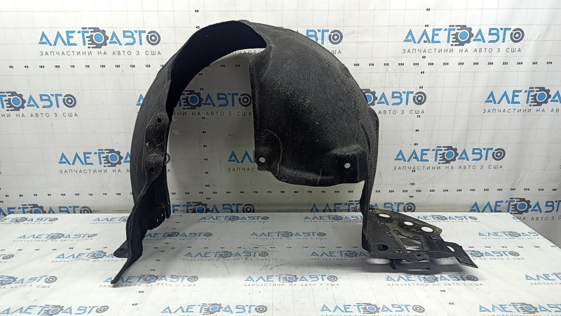 The front left fender liner of a Honda Accord 18-22 is torn at the mounting point.