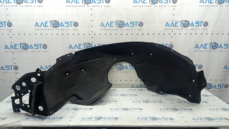 The front left fender liner of a Honda Accord 18-22 is torn at the mounting point.