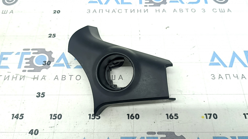 The front panel trim under the start/stop button for the Toyota Sienna 21-24 is black and scratched.