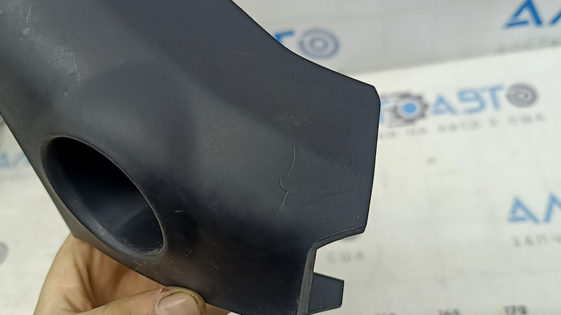 The front panel trim under the start/stop button for the Toyota Sienna 21-24 is black and scratched.