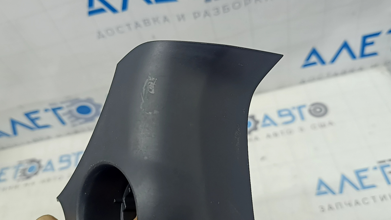 The front panel trim under the start/stop button for the Toyota Sienna 21-24 is black and scratched.