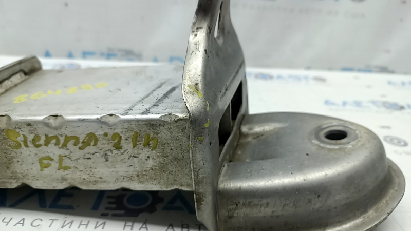 The fang of the lower reinforcement of the front bumper left Toyota Sienna 21-25 is dented, torn