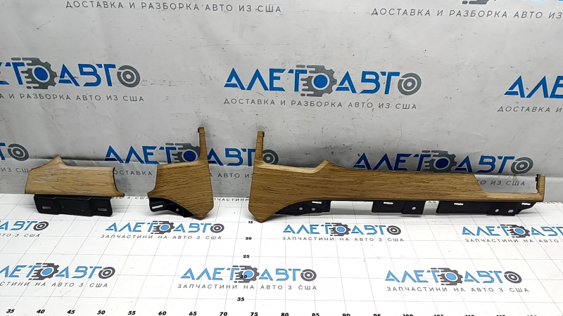 A set of front panel trims for the Tesla Model X 16-21 air vents in light wood, varnished.