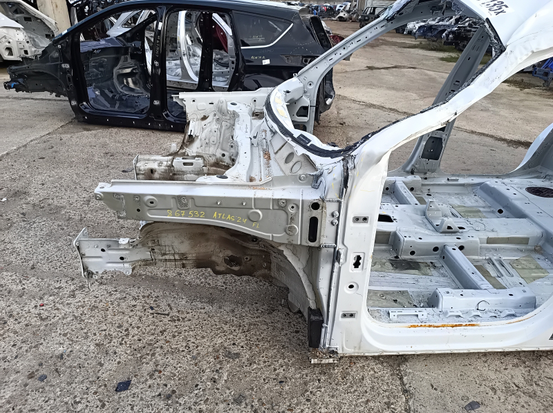 Front left quarter panel of a VW Atlas 18-25, white, dented pillar