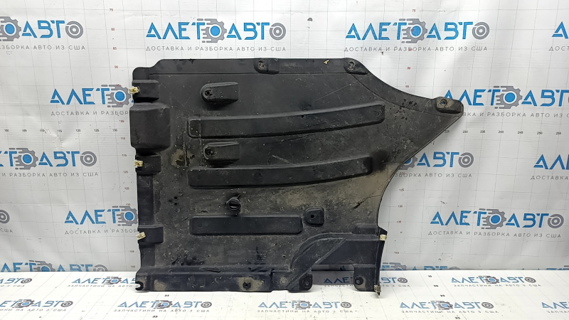 The rear left underbody protection of the BMW X3 G01 18-21 is torn and dented.