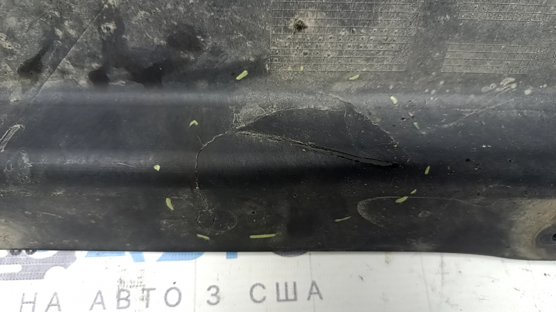 The rear left underbody protection of the BMW X3 G01 18-21 is torn and dented.