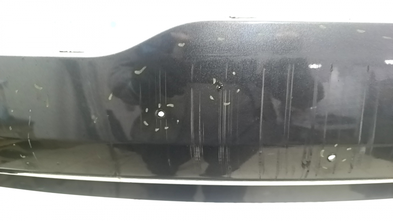 Bare front bumper for a 19-19 Lincoln MKC without parking sensors and a tow hook, J7 graphite, non-factory holes, scratches, and nicks