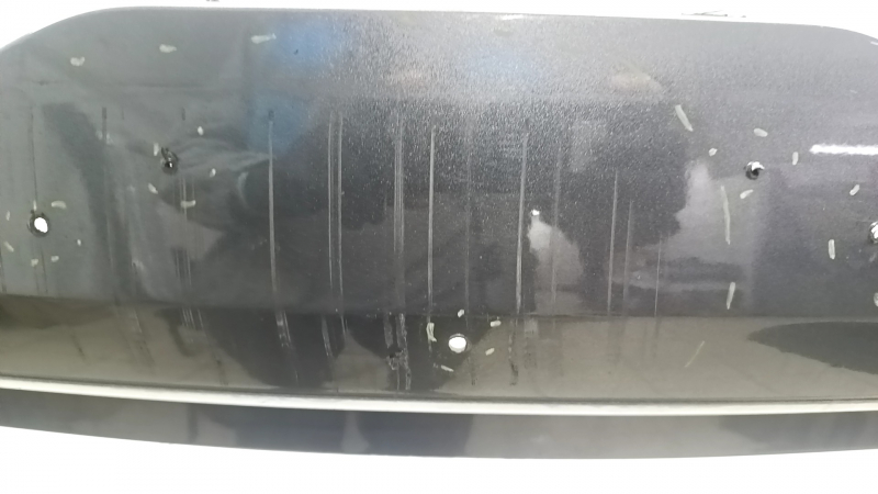 Bare front bumper for a 19-19 Lincoln MKC without parking sensors and a tow hook, J7 graphite, non-factory holes, scratches, and nicks