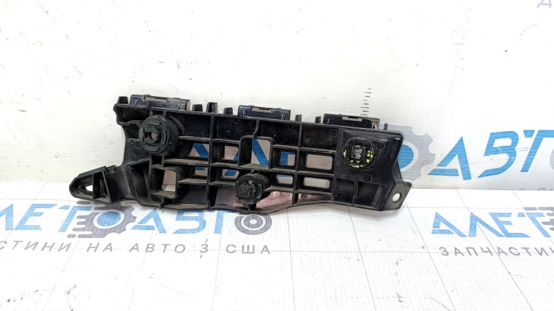 The front bumper mount, right, for a Lexus ES300h ES350 13-18, has a broken latch.