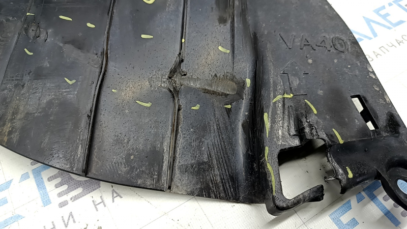 The left rear beam protection for a Mazda CX-50 23-25 is dented and torn.