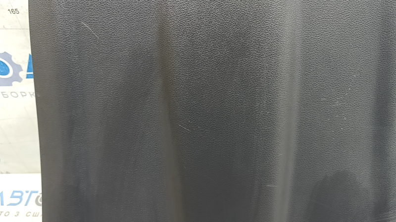 The rear driver's seat cover for a 2022 Hyundai Ioniq is black, with cracks in the fasteners and scratches.