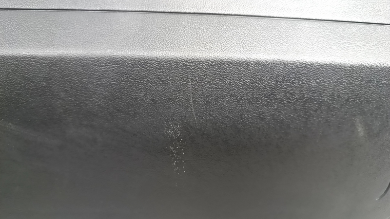 Tesla Model Y 20-25 passenger right knee airbag with black trim, scratches