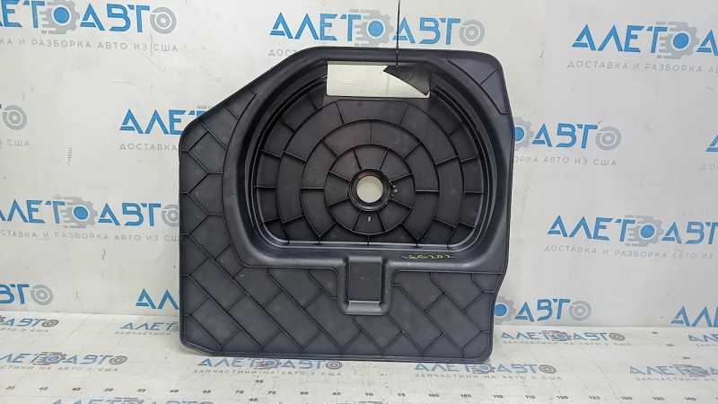The trunk tray for the spare tire of an Audi A4 B8 08-16 sedan has scratches, a dent, and a tear.