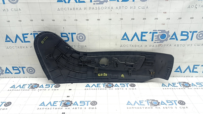 Infiniti QX50 19-25 driver's seat control cover is black, with cracks in the fasteners.