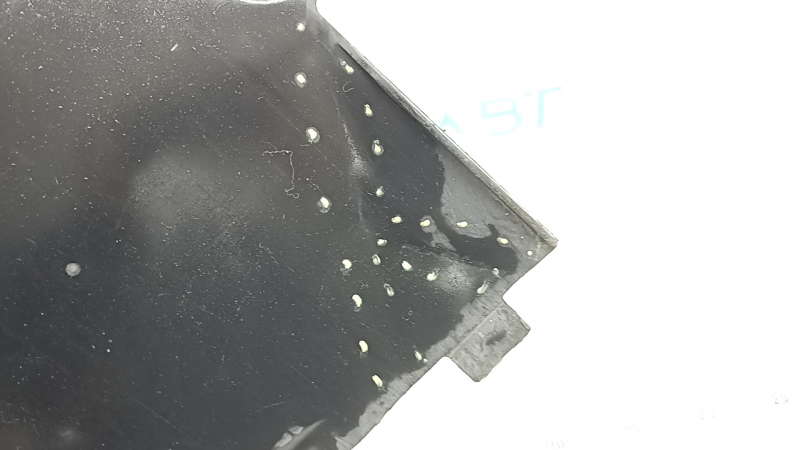 The front right underbody protection of the Audi A5 F5 18-25 is pressed and worn.