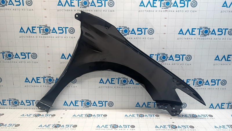 The front left fender of a Toyota Camry v70 18-24 is dented.