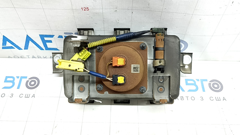The passenger airbag in the dashboard of a Subaru Forester 19-24 SK is covered in soot and has a rusty squib.