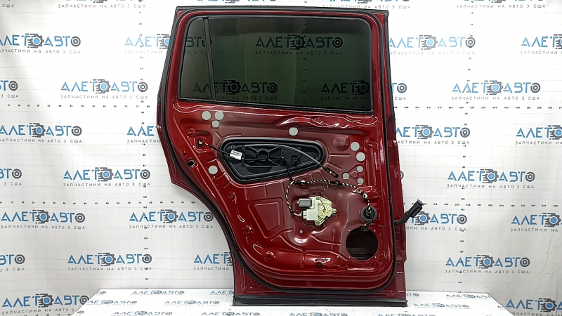 Rear left door assembly for a VW Tiguan 18-24 tinted, with black matte moldings and red LA3Q dent.