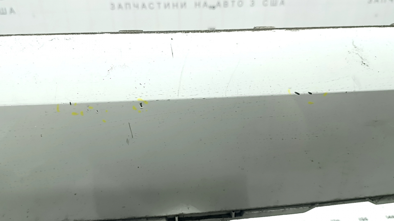 The bare lower rear bumper of a Volvo XC90 16-23, for parking sensors, white, scratches