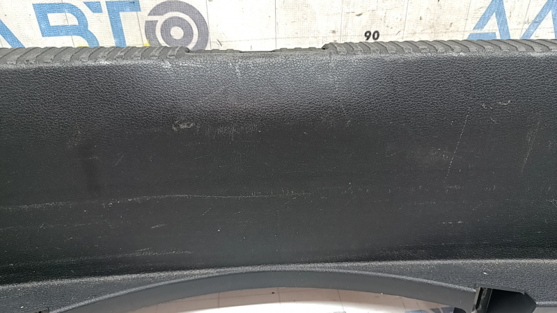The Audi A4 B9 17-20 trunk opening trim is black, worn, and the mount is broken.