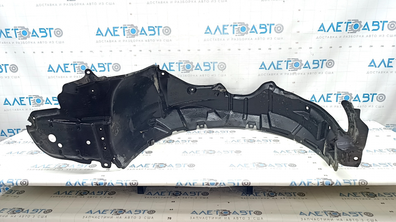 The front left fender liner of a Toyota Prius 30 10-15 is torn.