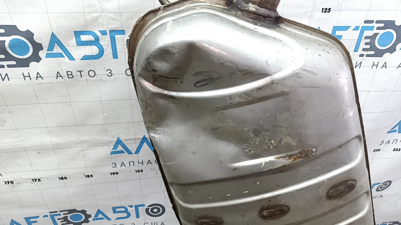 The rear muffler with a barrel for a VW Tiguan 20-24 fwd is dented.